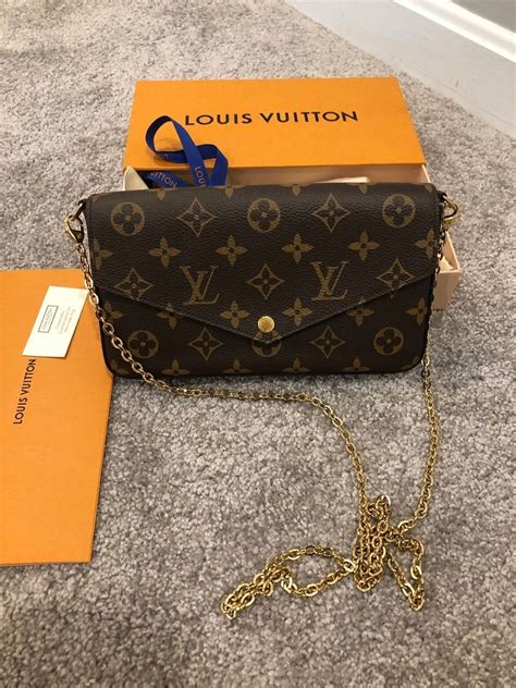 louis vuitton purse with gold chain|louis vuitton black checkered purse.